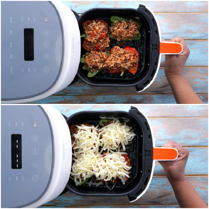 The stuffed peppers in air fryer basket.