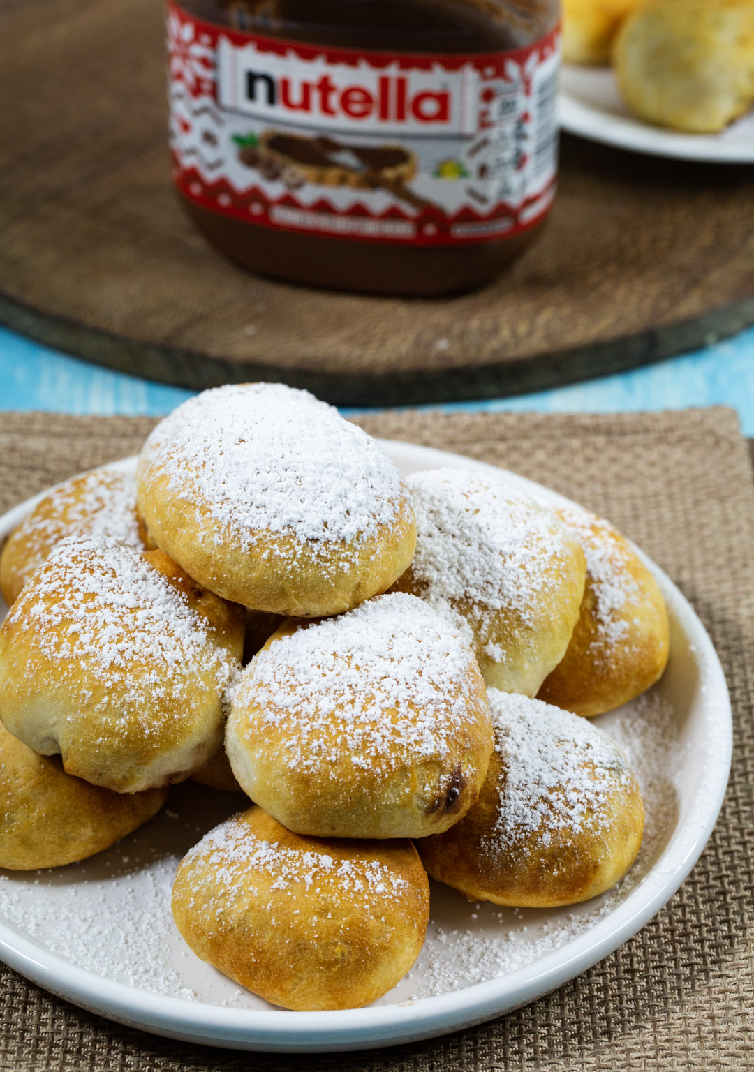 Nutella stuffed biscuits covered in powdered sugar.