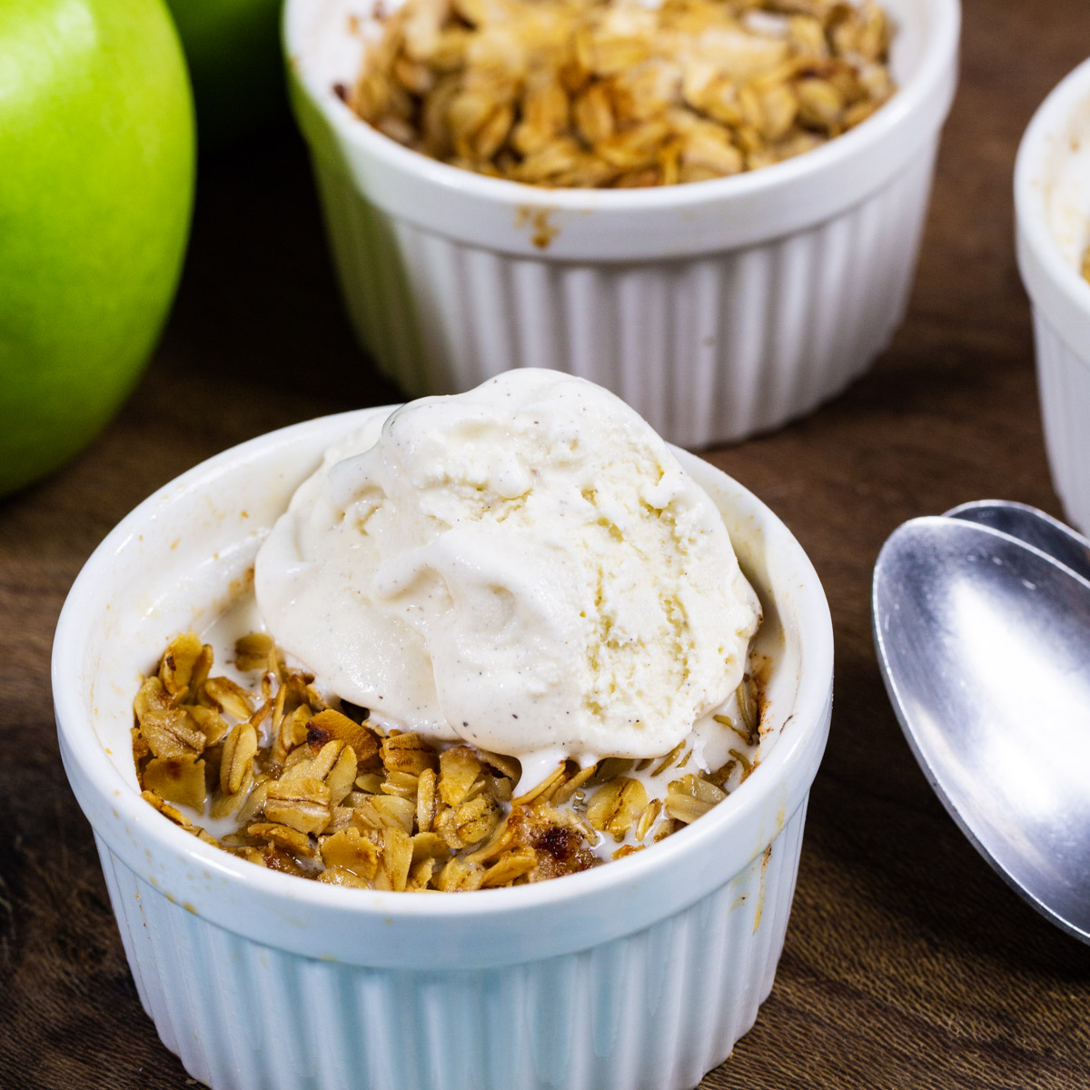 Air Fryer Apple Crisp topped with ice cream.