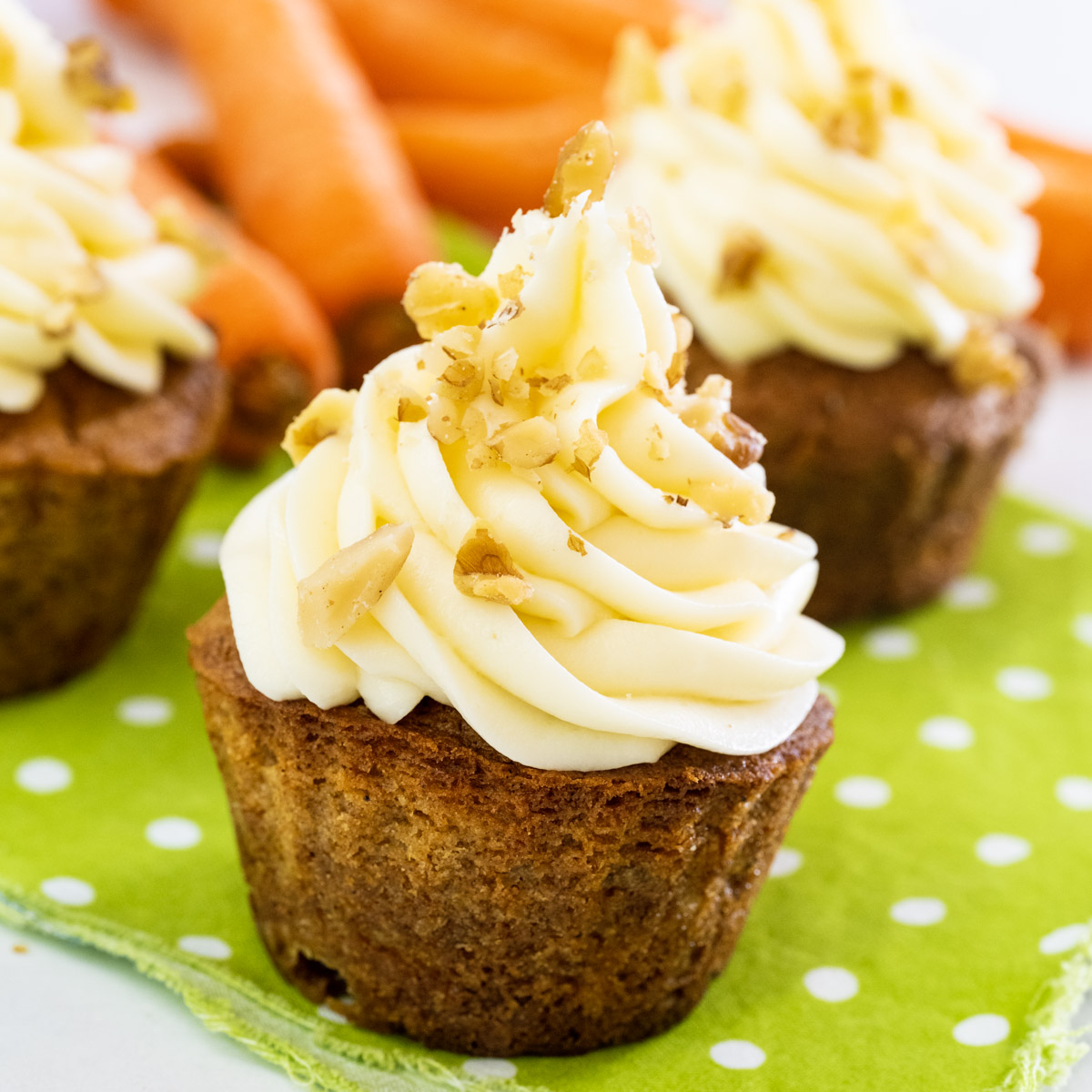 Air Fryer Carrot Cake Cupcakes topped with frosting.