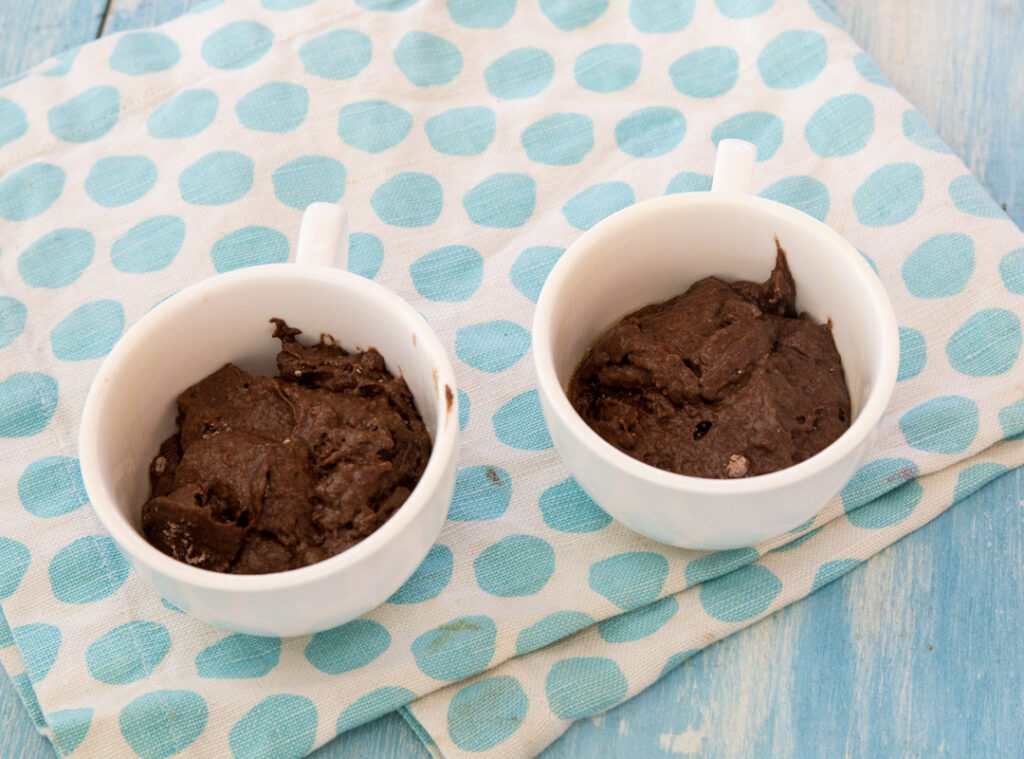 Uncooked batter in mugs.