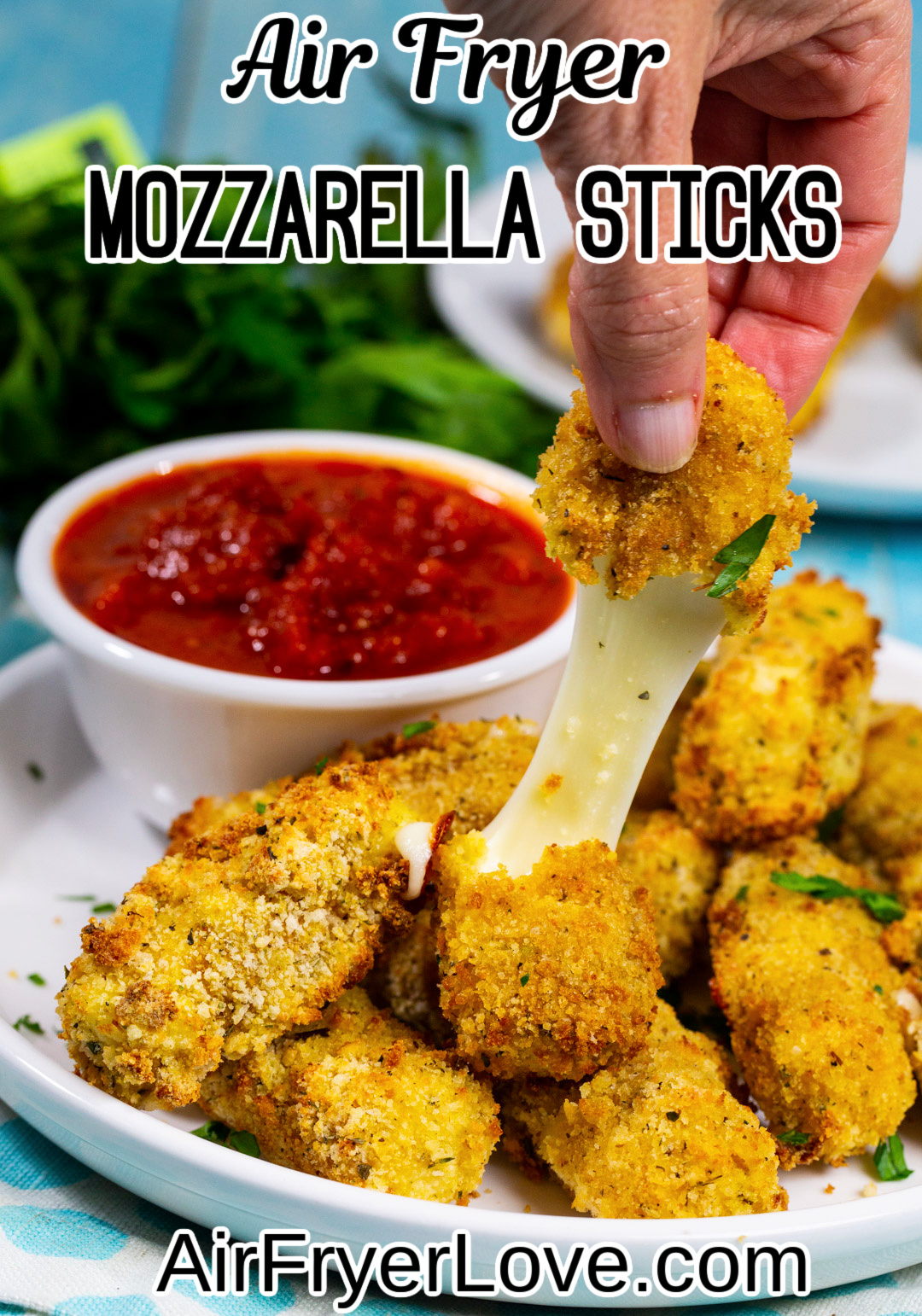 Mozzarella stick being pulled apart.