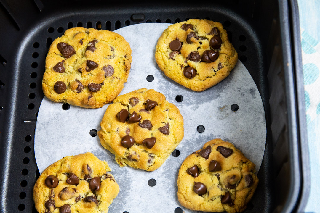 Chocolate Chip Cookies in air fryer basket.