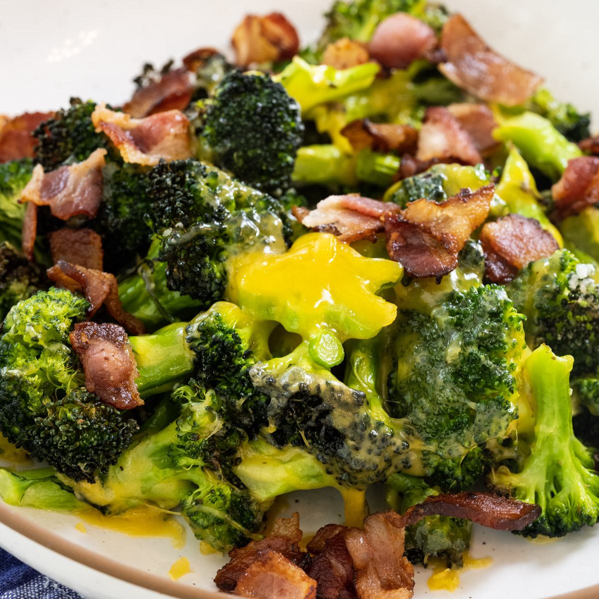 Air Fryer Broccoli with Bacon on a plate.
