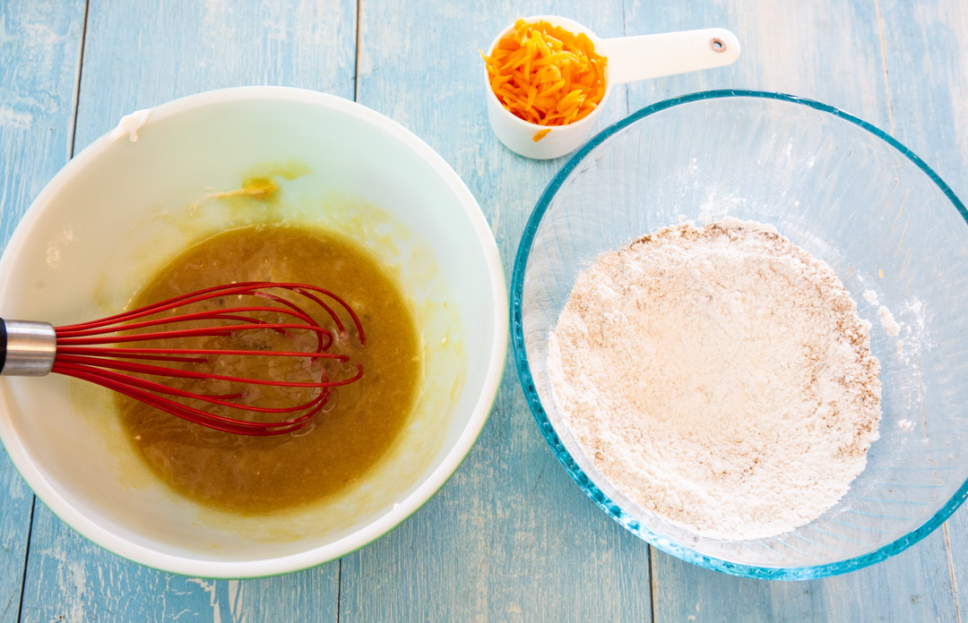 Dry ingredients in a bowl and wet ingredients in a bowl.