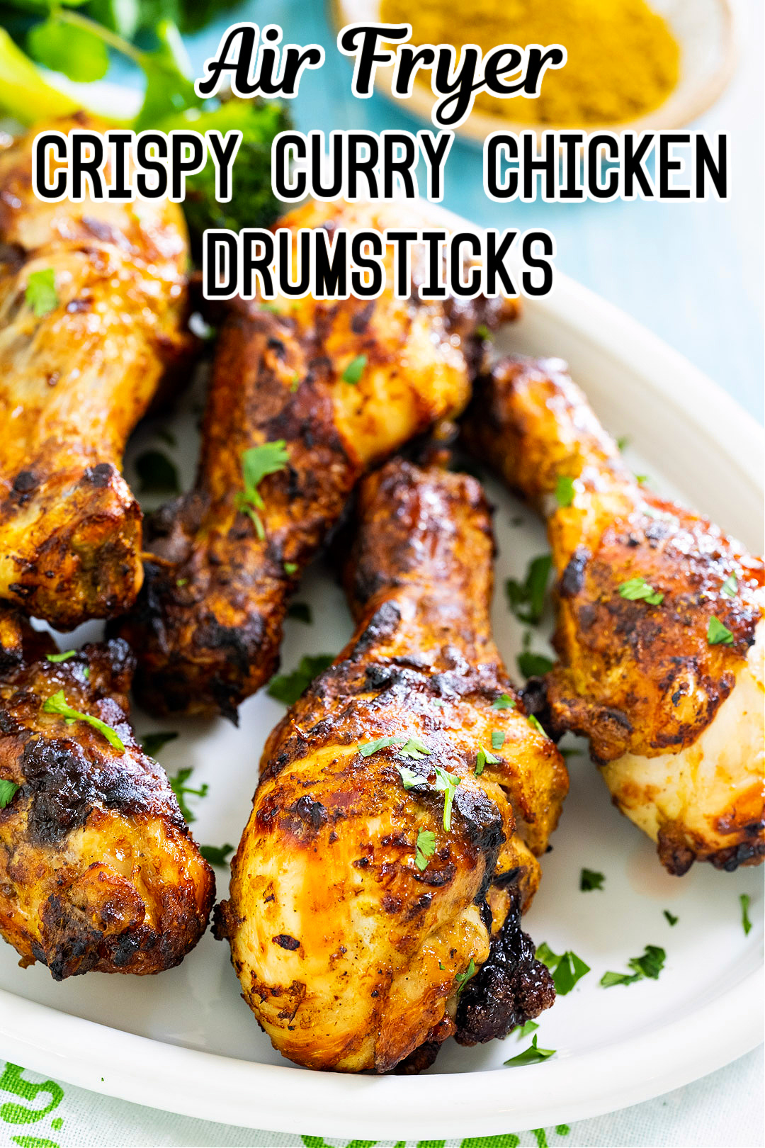 Air Fryer Curry Chicken Drumsticks on serving dish.