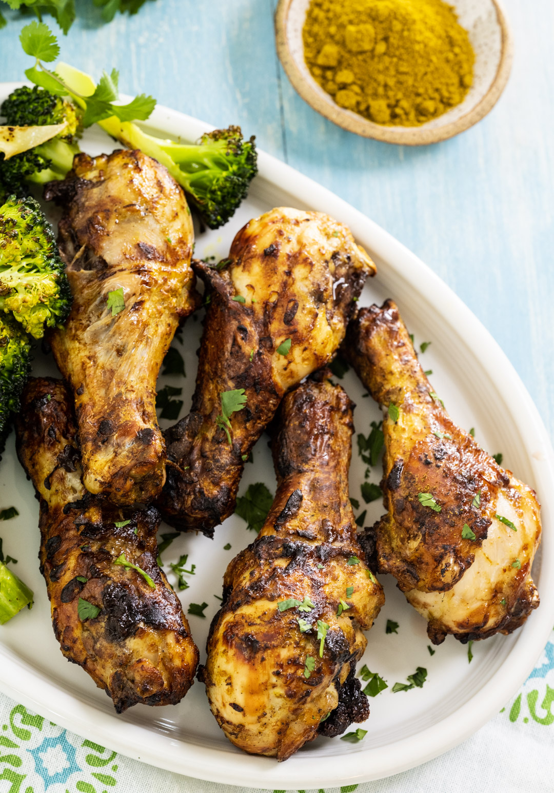 Curry Chicken Drumsticks on a serving plate.