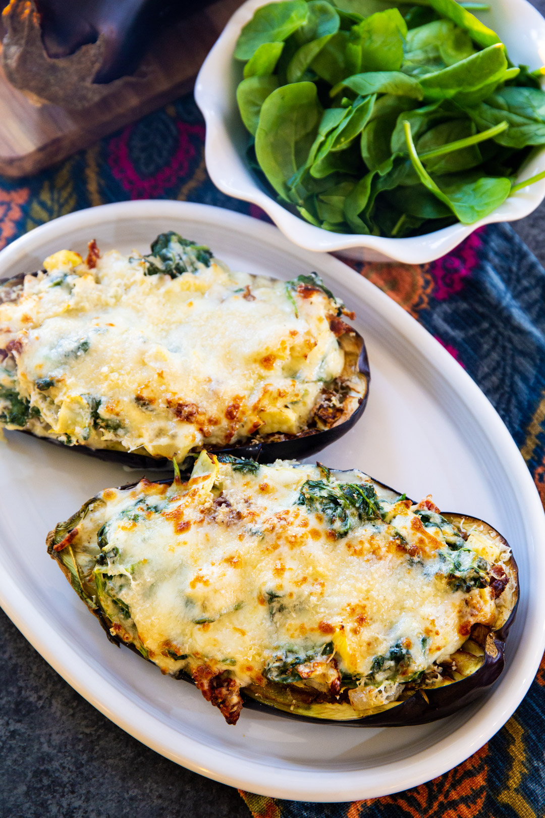 Air Fryer Spinach Artichoke Stuffed Eggplant on a serving plate.