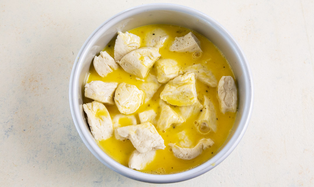 Egg mixture poured over biscuits.