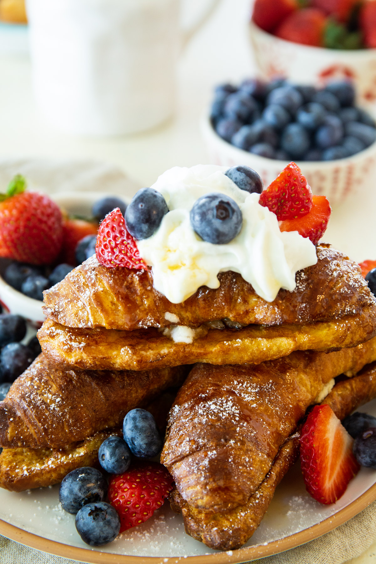 Close-up of Almond Croissant French Toast on a plate.