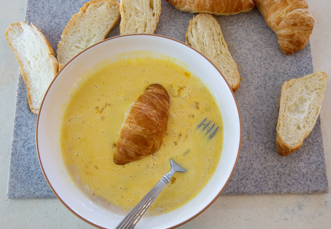 Croissant dipped in egg mixture.