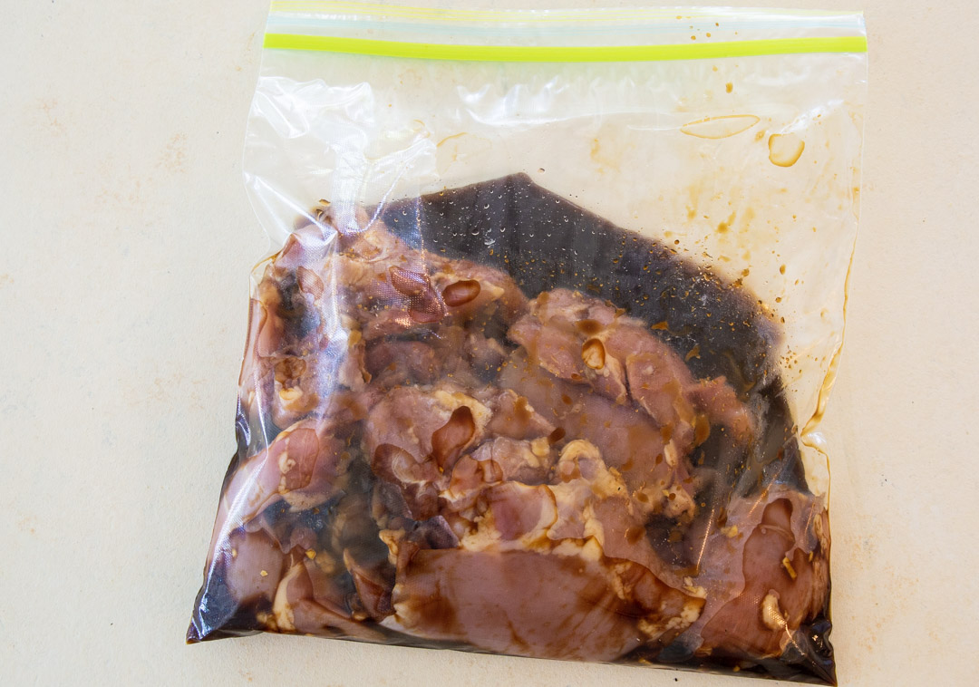 Chicken and marinade in a ziptop bag.