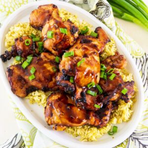Air Fryer Teriyaki Chicken over rice on a serving platter.