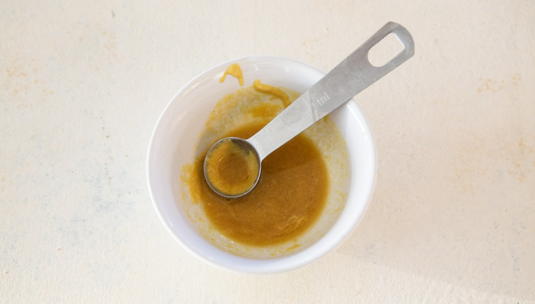 Maple glaze mixed in a small bowl.