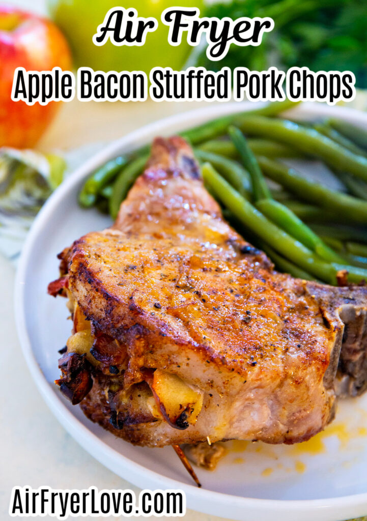 Close-up image of Apple Bacon Stuffed Pork Chop on a plate with green beans.