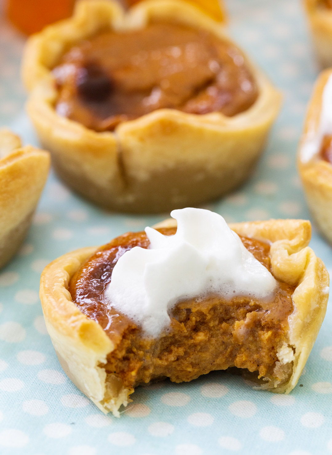 Close-up of a Pumpkin Tart with a bite taken out.