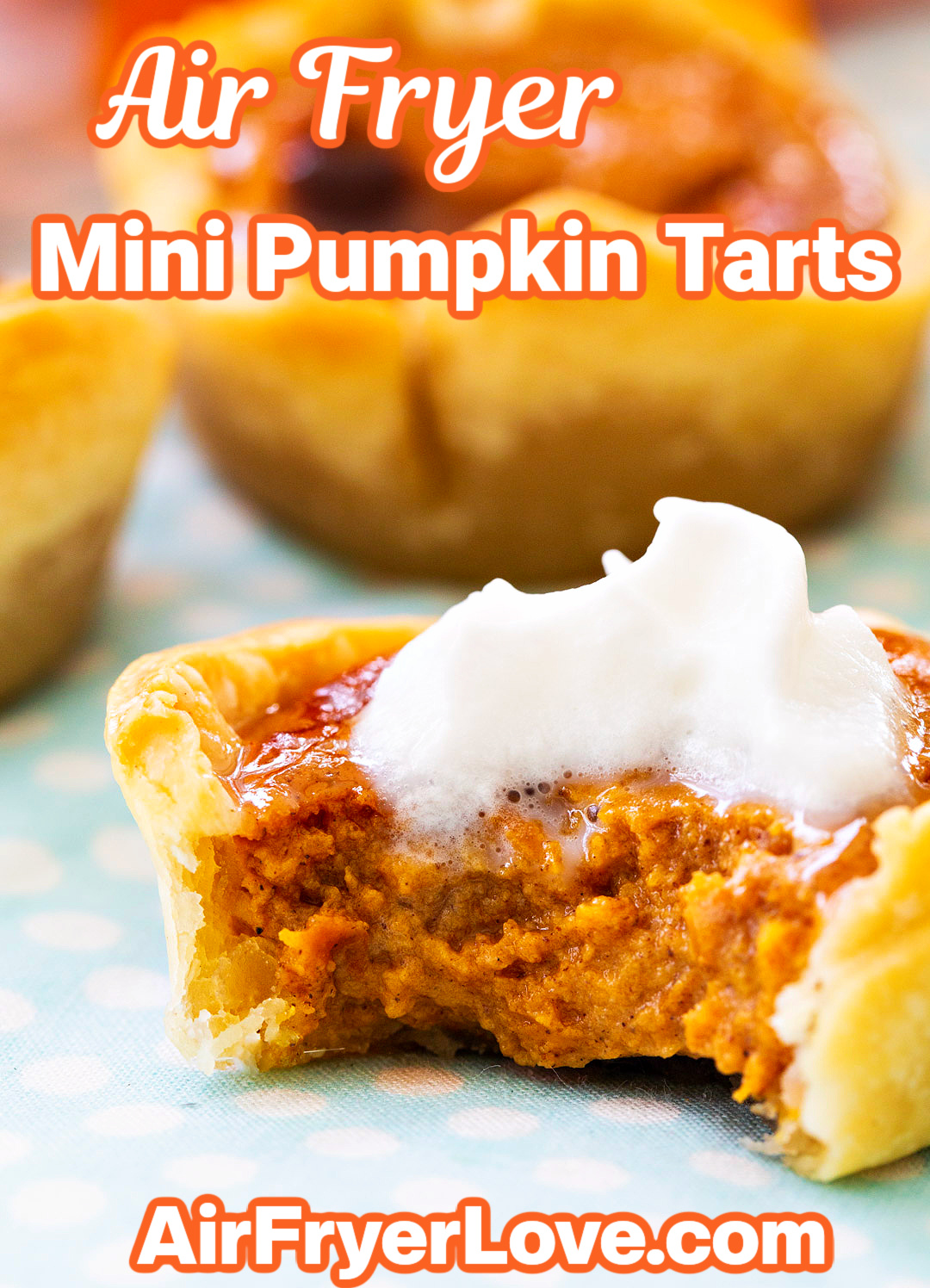 Close-up of a Mini Pumpkin Tart with a bite taken out.